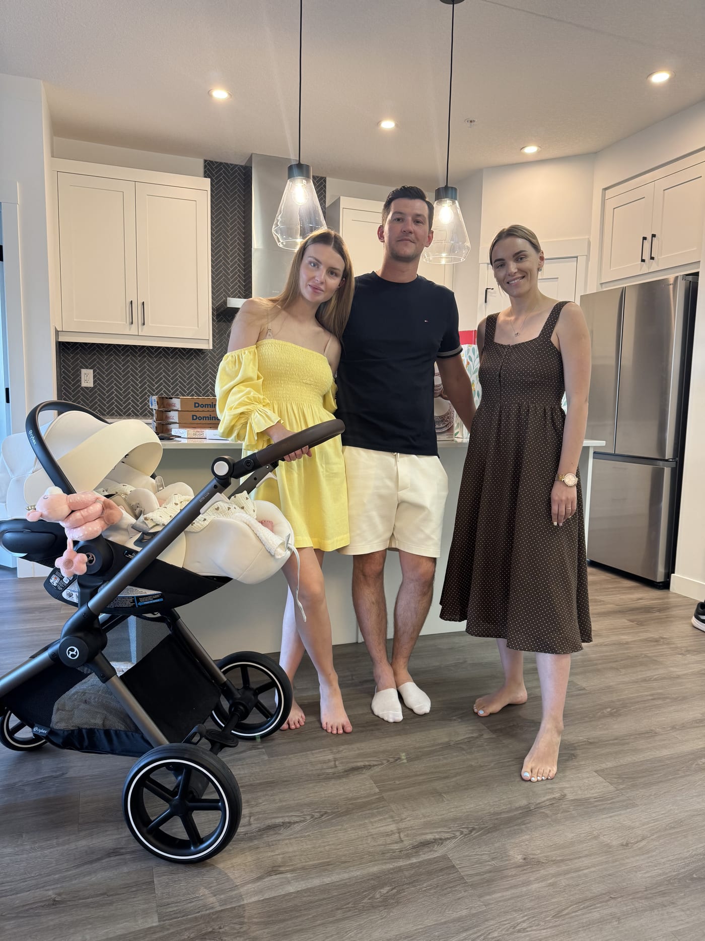 A family celebrating in the kitchen of their new home