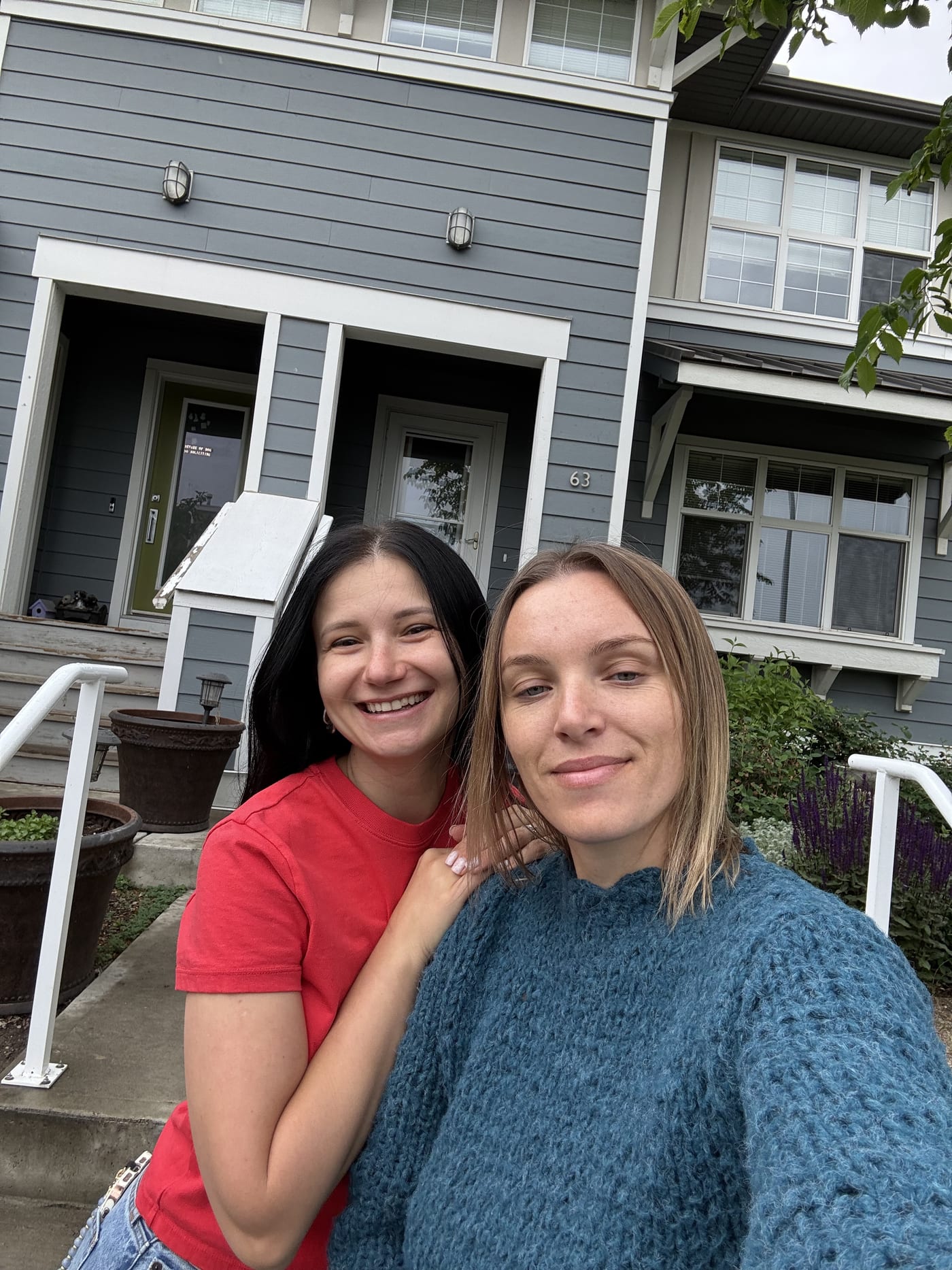 Clients outside their newly purchased townhouse